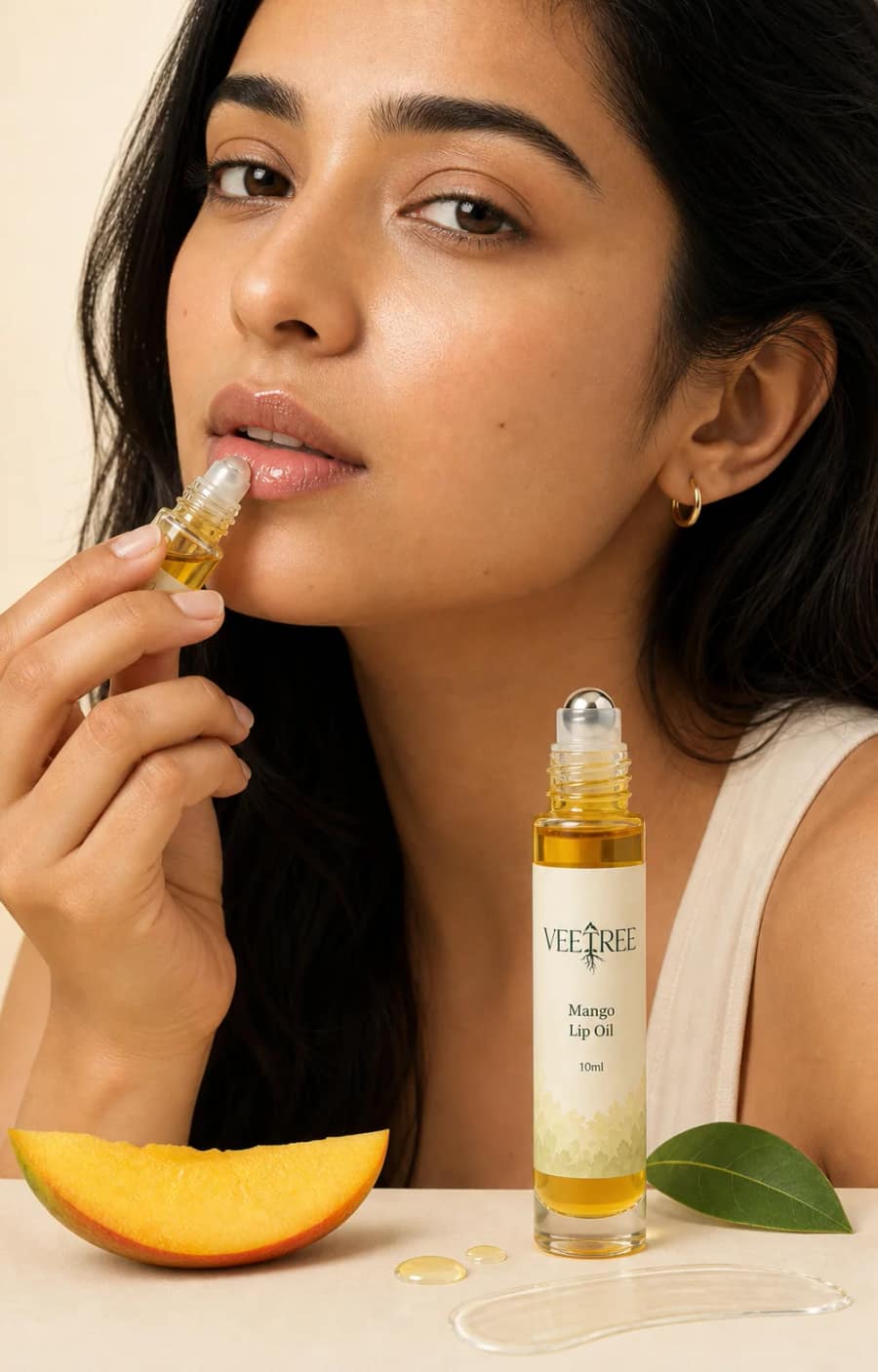 Mango Lip Oil texture and application shown in a VEETREE studio photograph