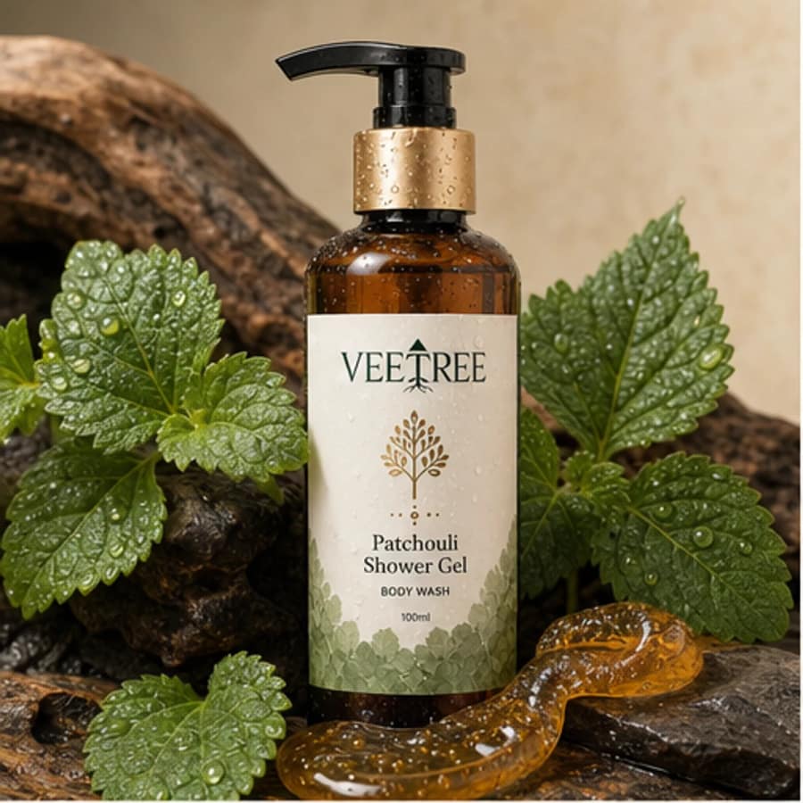 Patchouli Shower Gel arranged with its featured botanical ingredients