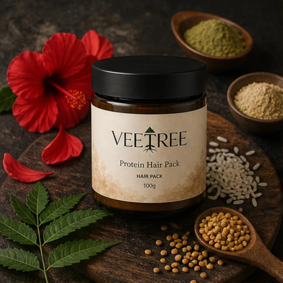 Protein Hair Pack arranged with its featured botanical ingredients