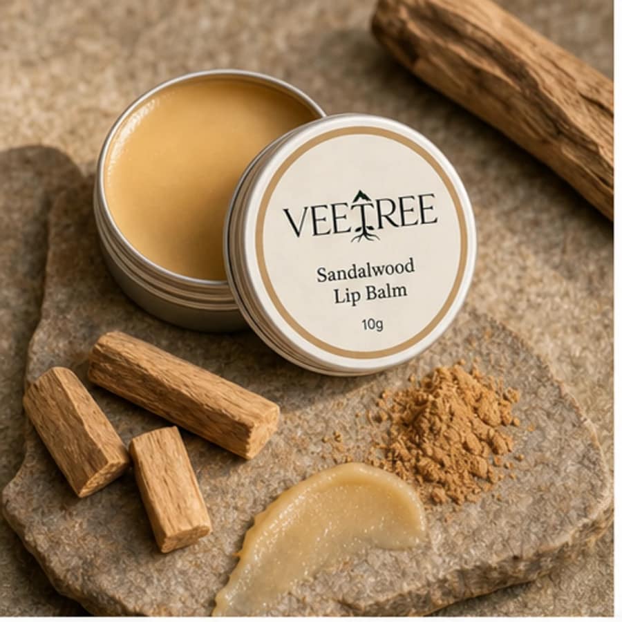 Sandalwood Lip Balm arranged with its featured botanical ingredients