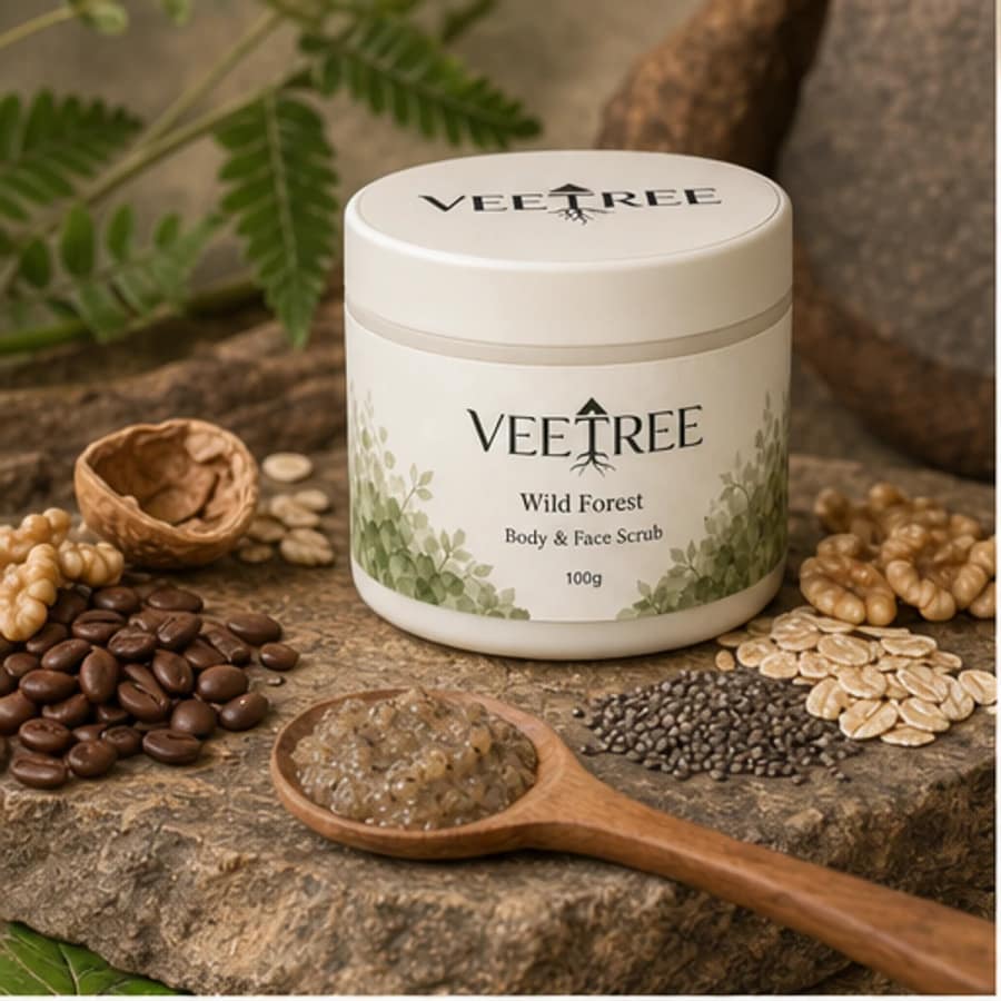 Body & Face Scrub arranged with its featured botanical ingredients